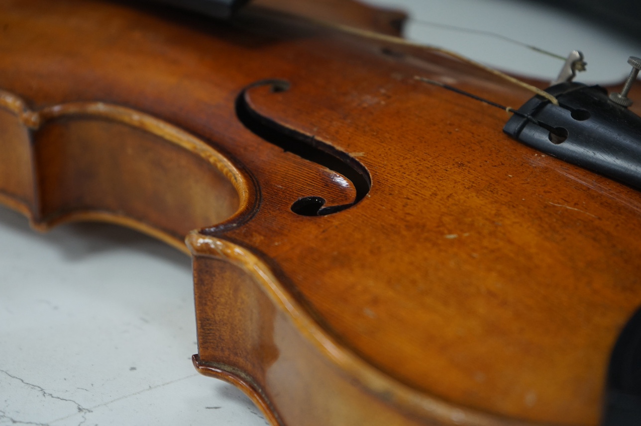 A cased full length violin, circa 1900 with bow, bears Stradivarius label to the interior. CITES Submission reference WVME8714